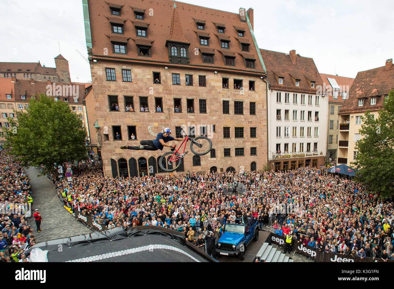 Nuremberg, Germany. 02nd Sep, 2017. The freestyle mountain biker Szymon Godziek from Poland jumps over a ramp during the the first final round of the 'Red Bull District Ride' in Nuremberg, Germany, 02 September 2017. Photo: Daniel Karmann/dpa/Alamy Live News Stock Photo