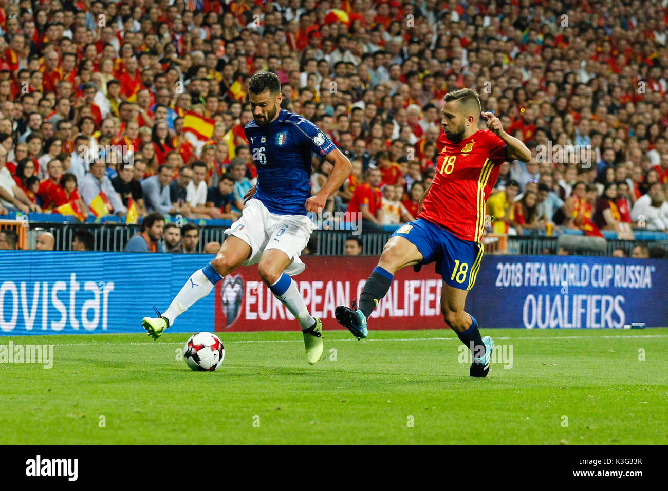 Antonio Candreva (6) Italian player. Jordi Alba (18) Spanish player.  In action during the qualifying match for the 2018 World Cup, Round 7, between Spain vs Italy at the Santiago Bernabeu stadium in Madrid, Spain, September 2, 2017 . Stock Photo