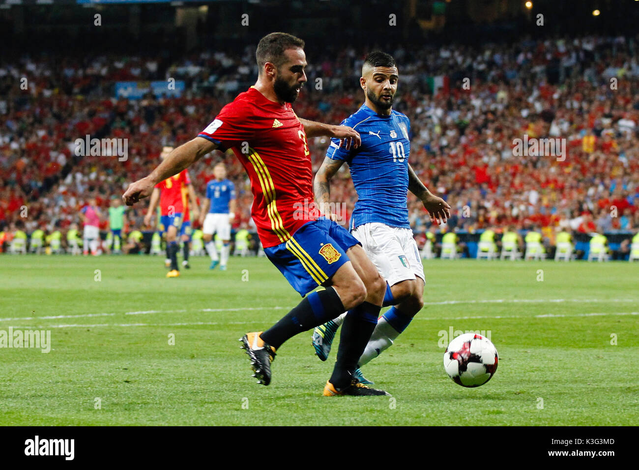 Dani Carvajal (2) Spanish player. Lorenzo Insigne (10) Italian player.  In action during the qualifying match for the 2018 World Cup, Round 7, between Spain vs Italy at the Santiago Bernabeu stadium in Madrid, Spain, September 2, 2017 . Stock Photo