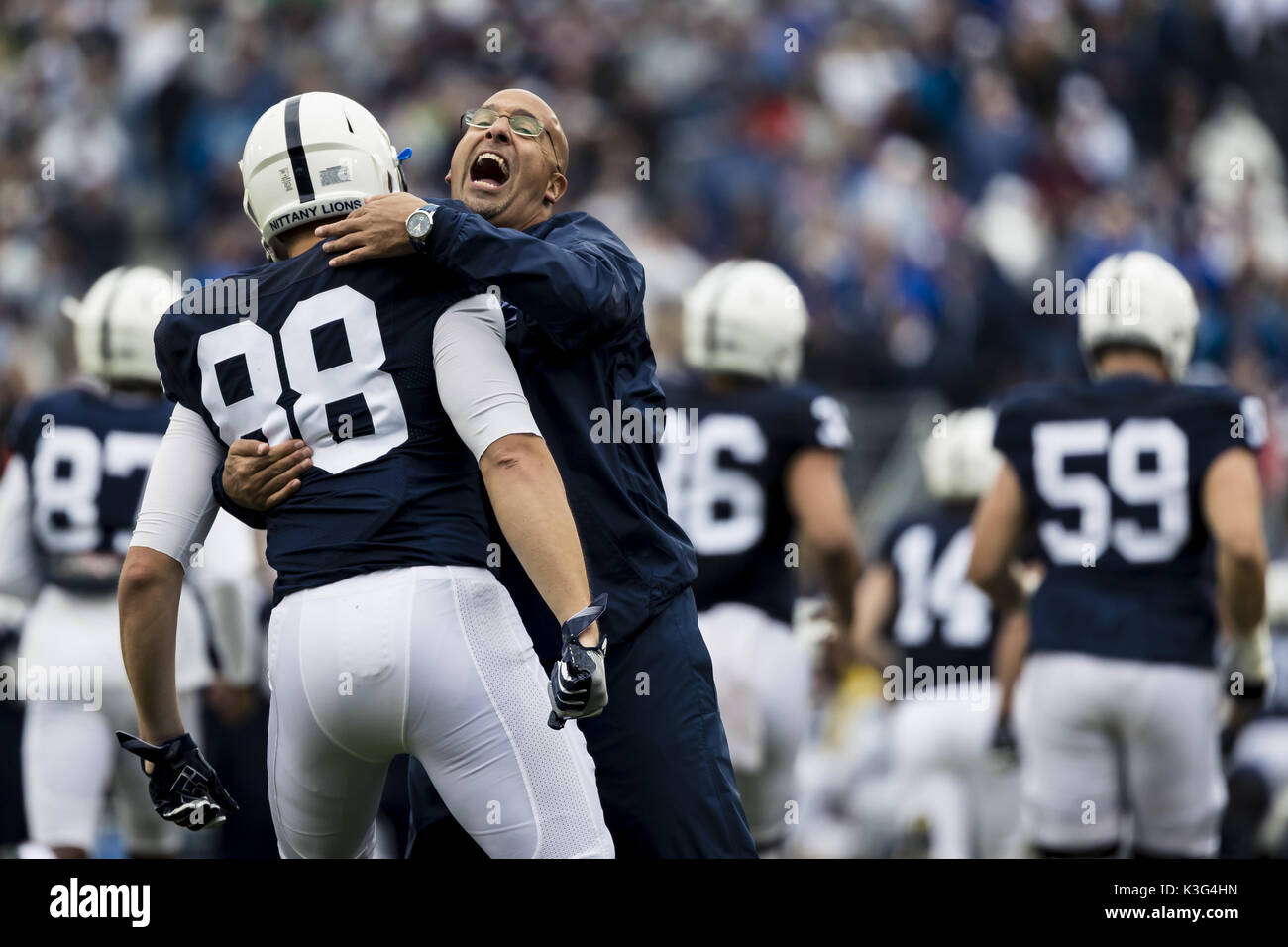 University Park, Pennsylvania, USA. 2nd Sep, 2017. September 02, 2017: Penn State Nittany Lions head coach James Franklin hugs Penn State Nittany Lions tight end Mike Gesicki (88) as they take the field during the NCAA football game between Penn State Nittany Lions and Akron Zips at Beaver Stadium in University Park, Pennsylvania. Credit: Scott Taetsch/ZUMA Wire/Alamy Live News Stock Photo