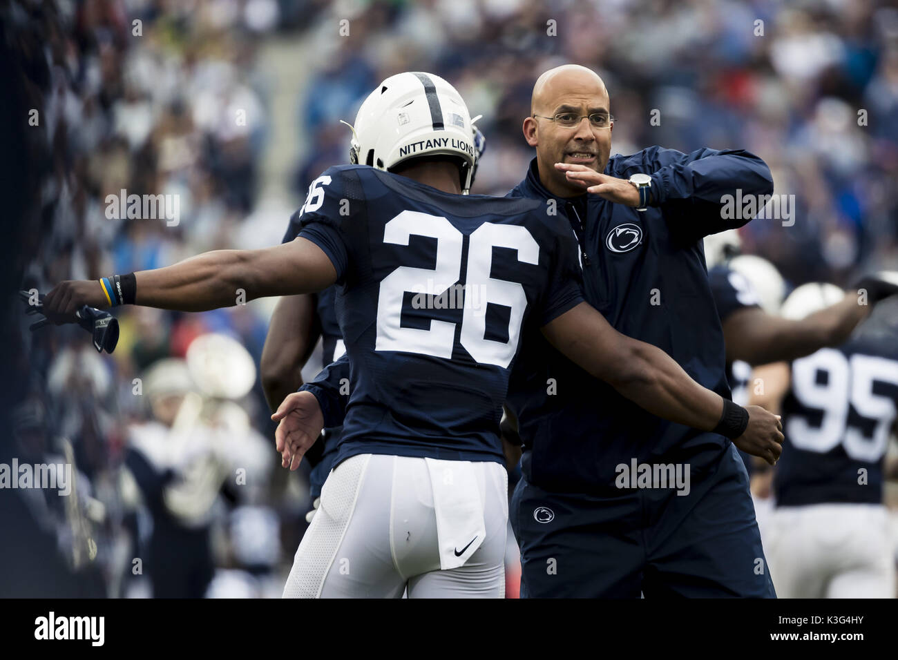 University Park, Pennsylvania, USA. 2nd Sep, 2017. September 02, 2017: Penn State Nittany Lions head coach James Franklin hugs Penn State Nittany Lions running back Saquon Barkley (26) as they take the field during the NCAA football game between Penn State Nittany Lions and Akron Zips at Beaver Stadium in University Park, Pennsylvania. Credit: Scott Taetsch/ZUMA Wire/Alamy Live News Stock Photo