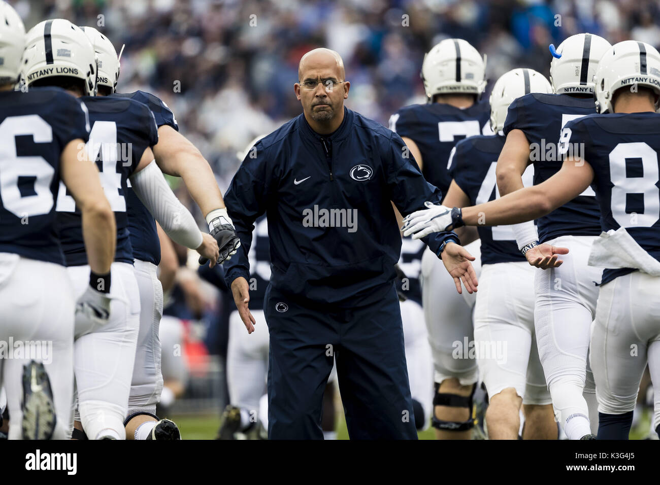 University Park, Pennsylvania, USA. 2nd Sep, 2017. September 02, 2017: Penn State Nittany Lions head coach James Franklin greets his players as they take the field during the NCAA football game between Penn State Nittany Lions and Akron Zips at Beaver Stadium in University Park, Pennsylvania. Credit: Scott Taetsch/ZUMA Wire/Alamy Live News Stock Photo
