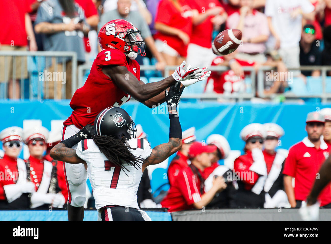Charlotte, NC, USA. 2nd Sep, 2017. Kelvin Harmon (3) of the NC State Wolfpack makes the catch over JaMarcus King (7) of the South Carolina Gamecocks to setup the game tying touchdown before halftime of the NCAA football matchup between the NC State Wolfpack and the South Carolina Gamecocks at Bank of America Stadium in Charlotte, NC. (Scott Kinser/Cal Sport Media) Credit: csm/Alamy Live News Stock Photo