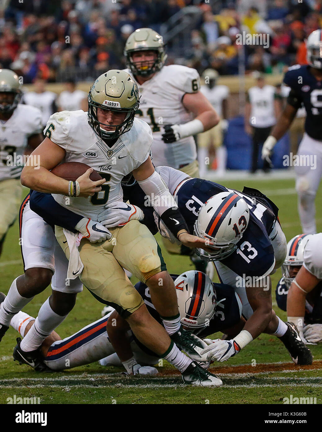 Charlottesville, Virginia, USA. 2nd Sep, 2017. William & Mary Tribe QB/P #6 Tommy McKee is dragged down during NCAA football game between the University of Virginia Cavaliers and the William & Mary Tribe at Scott Stadium in Charlottesville, Virginia. Justin Cooper/CSM/Alamy Live News Stock Photo