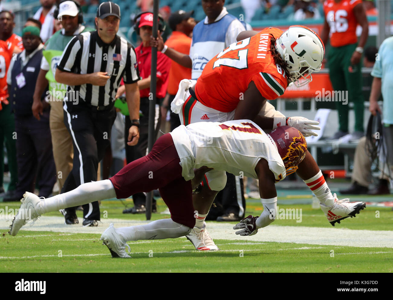 Miami Gardens, Florida, USA. 02nd Sep, 2017. Miami Hurricanes tight end Michael Irvin II (87) advances the ball, avoiding a tackle by Bethune Cookman Wildcats cornerback Elliott Miller (7), during the college football game between the Bethune-Cookman Wildcats and the Miami Hurricanes at the Hard Rock Stadium in Miami Gardens, Florida. The Hurricanes won 41-13. Mario Houben/CSM/Alamy Live News Stock Photo