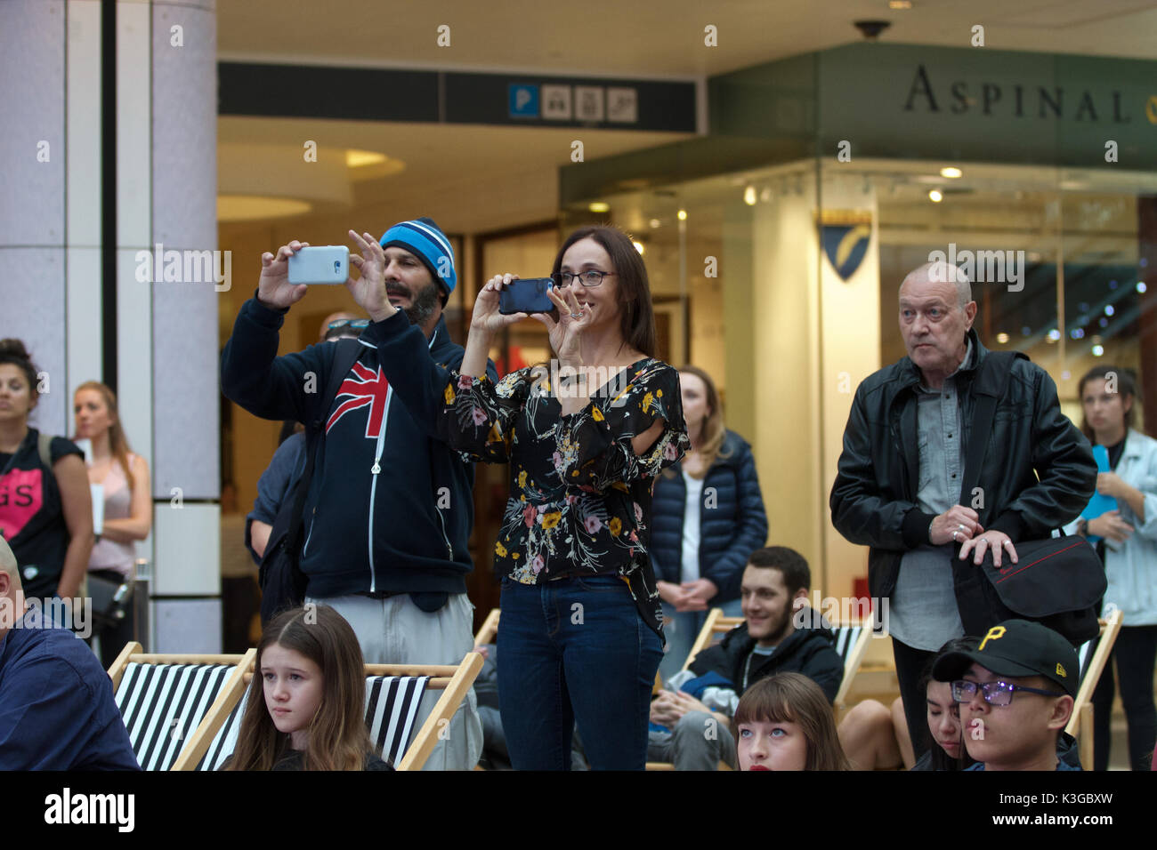 London, UK. 3rd September, 2017. People take photos with their mobile phones at The Mayor of London’s Gigs Grand Final which took place in Westfield, Sheperds Bush,London. Twelve finalists battle it out .Gigs is more than a competition. For those who stay the course, a whole host of opportunities opens up to them through the wider Busk in London programme – paid bookings, private land busking schemes with earning potential, event management work and industry access.©Keith Larby/Alamy Live News Stock Photo