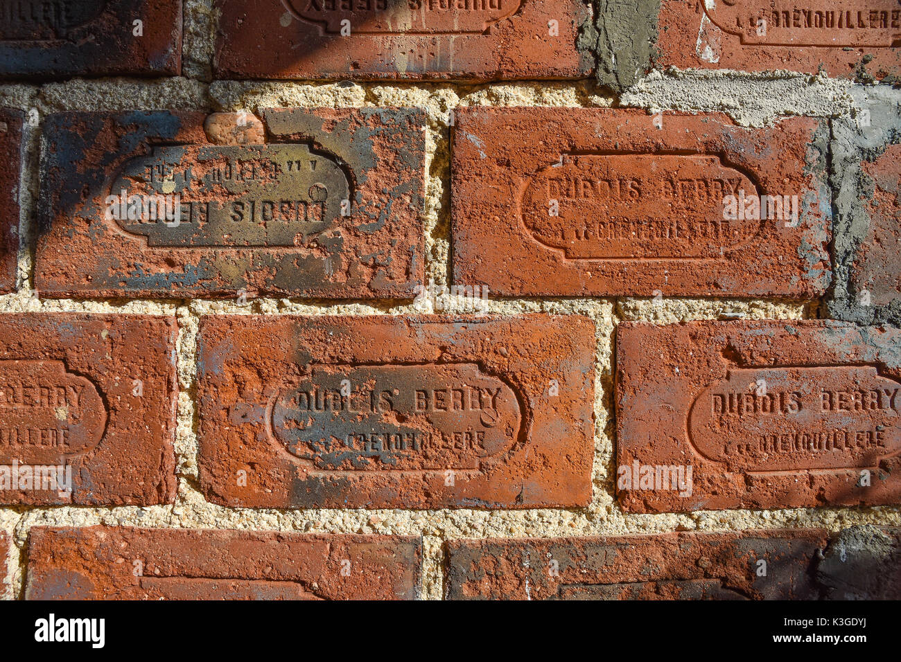 Maker's name moulded into fired bricks - France. Stock Photo