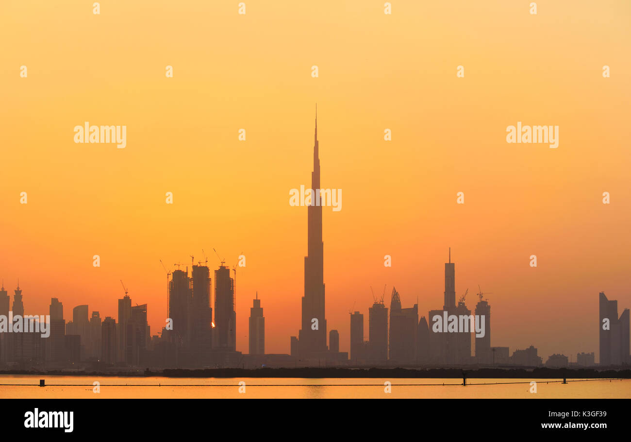 Dubai city skyline at sunset Stock Photo Alamy