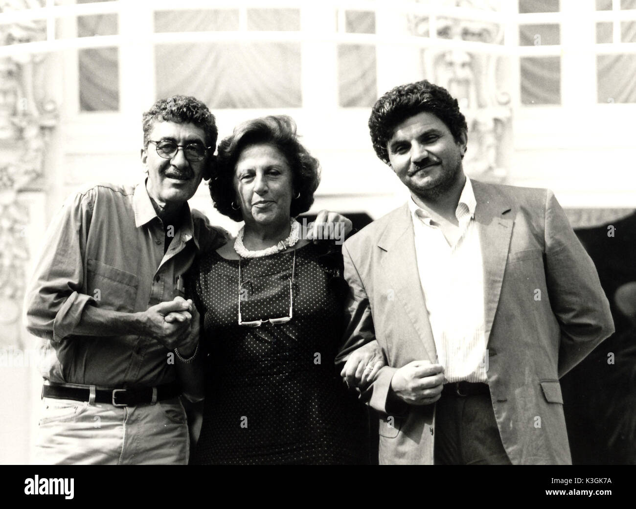 Film director DANIEL SCHMID, actress MADDALENA FELLINI and Festival co-director GIAN FRANCO MIRO GORI on the terrace of the Grand Hotel during the Rimini Film Festival Film director DANIEL SCHMID, actress MADDALENA FELLINI Stock Photo