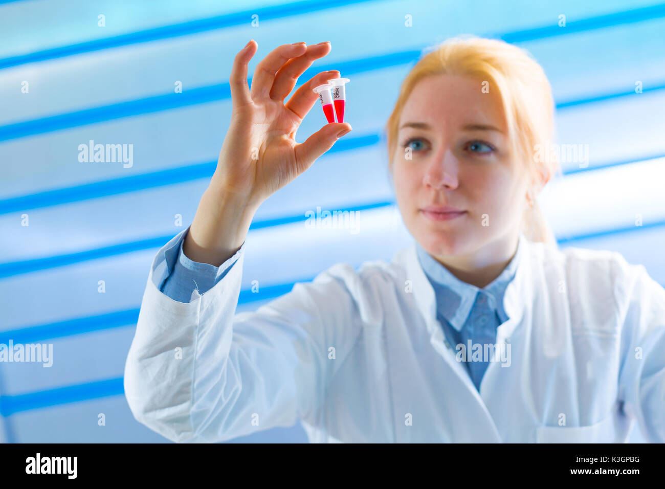 Student with test tube Stock Photo Alamy
