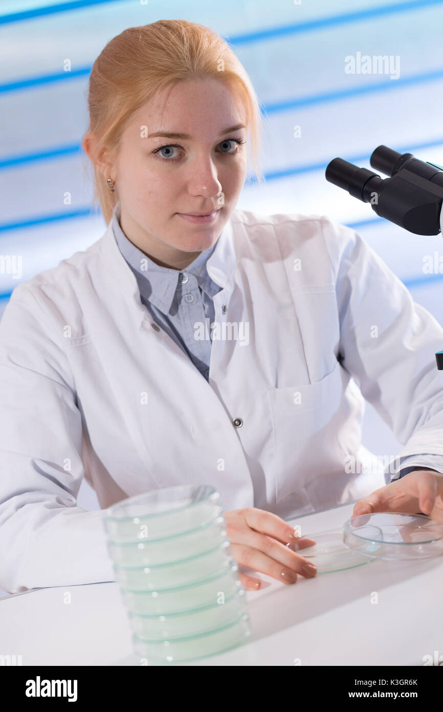 scientist woman holding petri dish Stock Photo Alamy