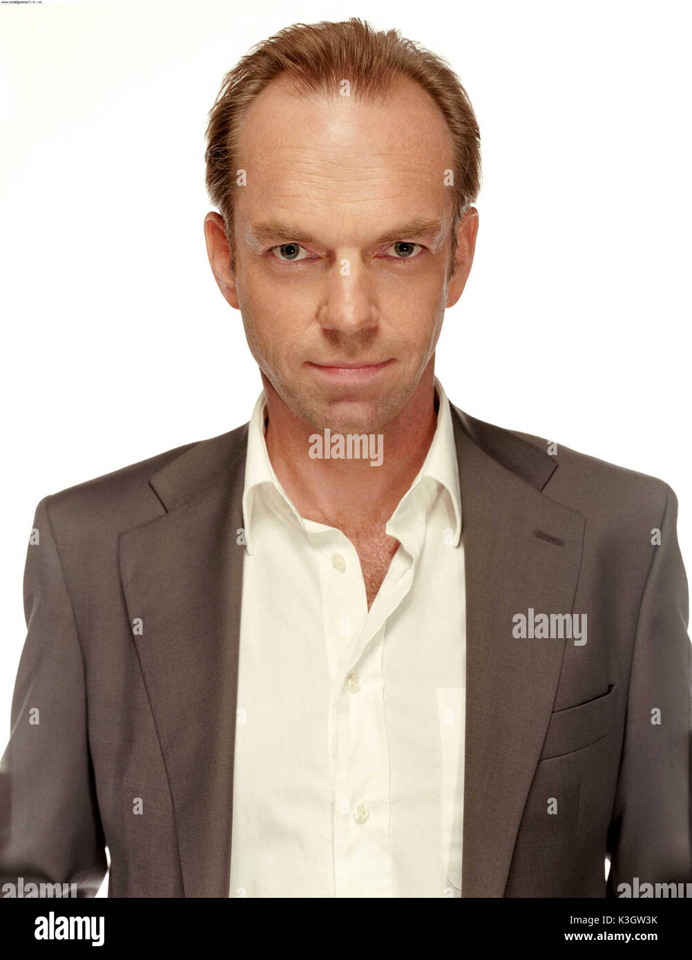 Hugo Weaving speaks to a TV reporter upon his arrival for the Tokyo premier  of his latest film V for Vendetta Monday, April 17, 2006. The political  action thriller, that stars Weaving