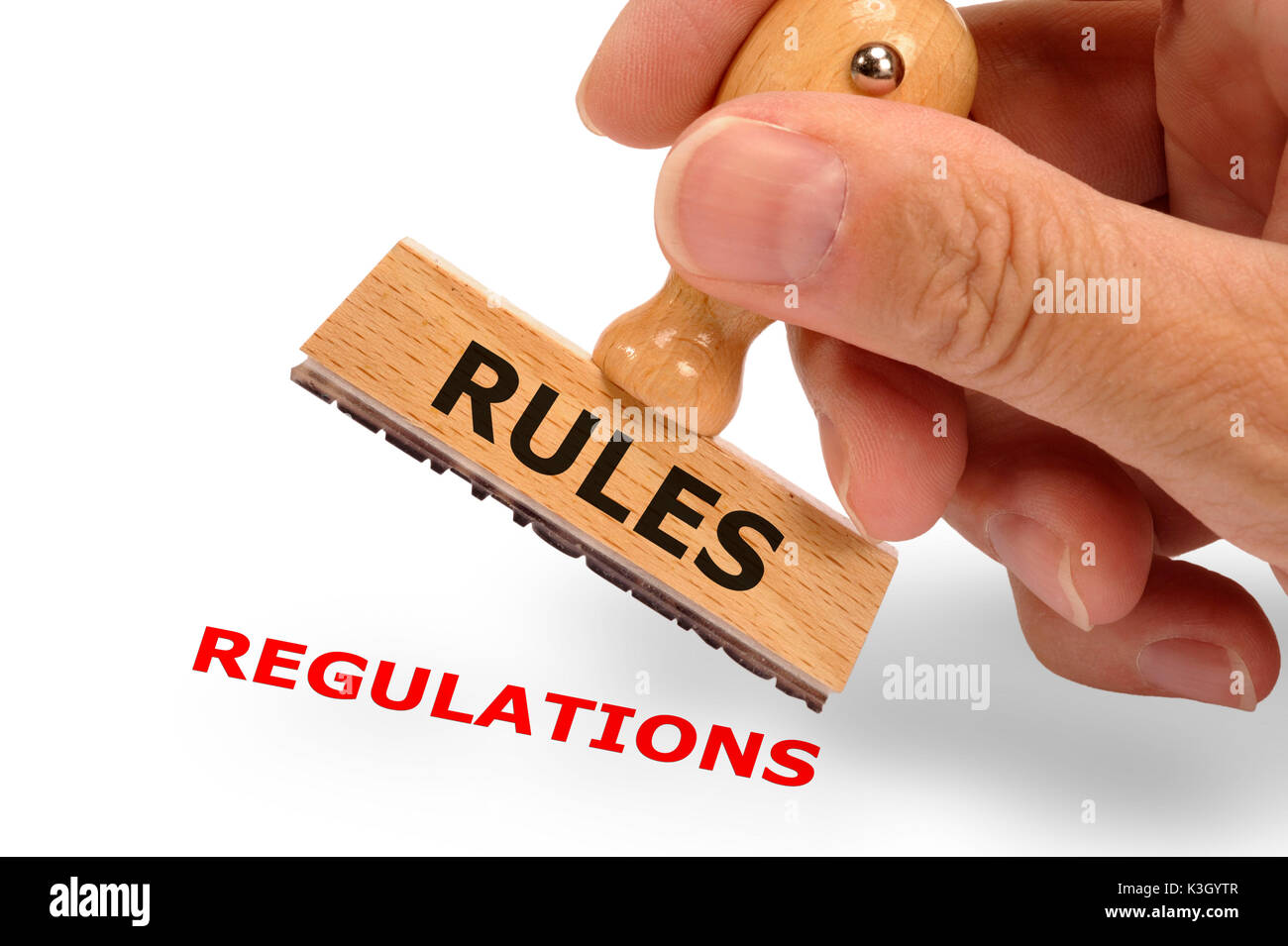 rules and regulations selects on and from a wooden stamp Stock Photo