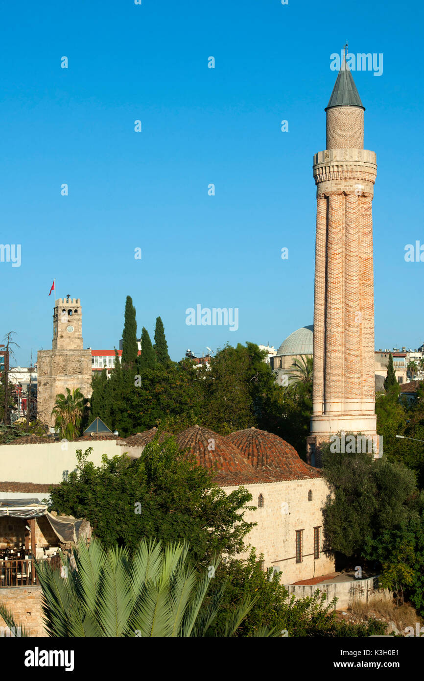 Turkey, Antalya, Alaaddin mosque close the Yivli Minare, on the left the clock tower Stock Photo