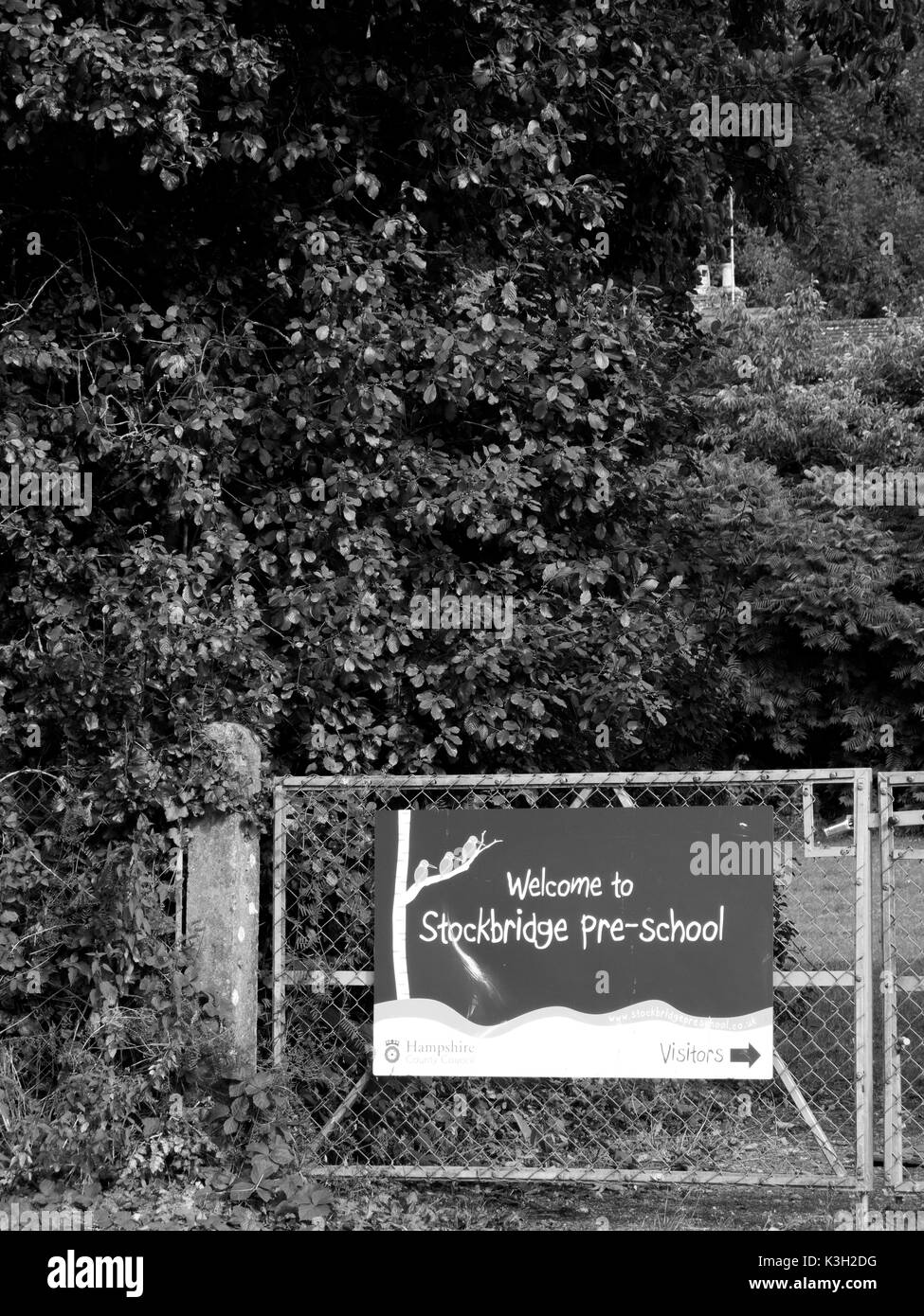 Welcome to Stockbridge pre school banner mounted on gate to playing field Stock Photo