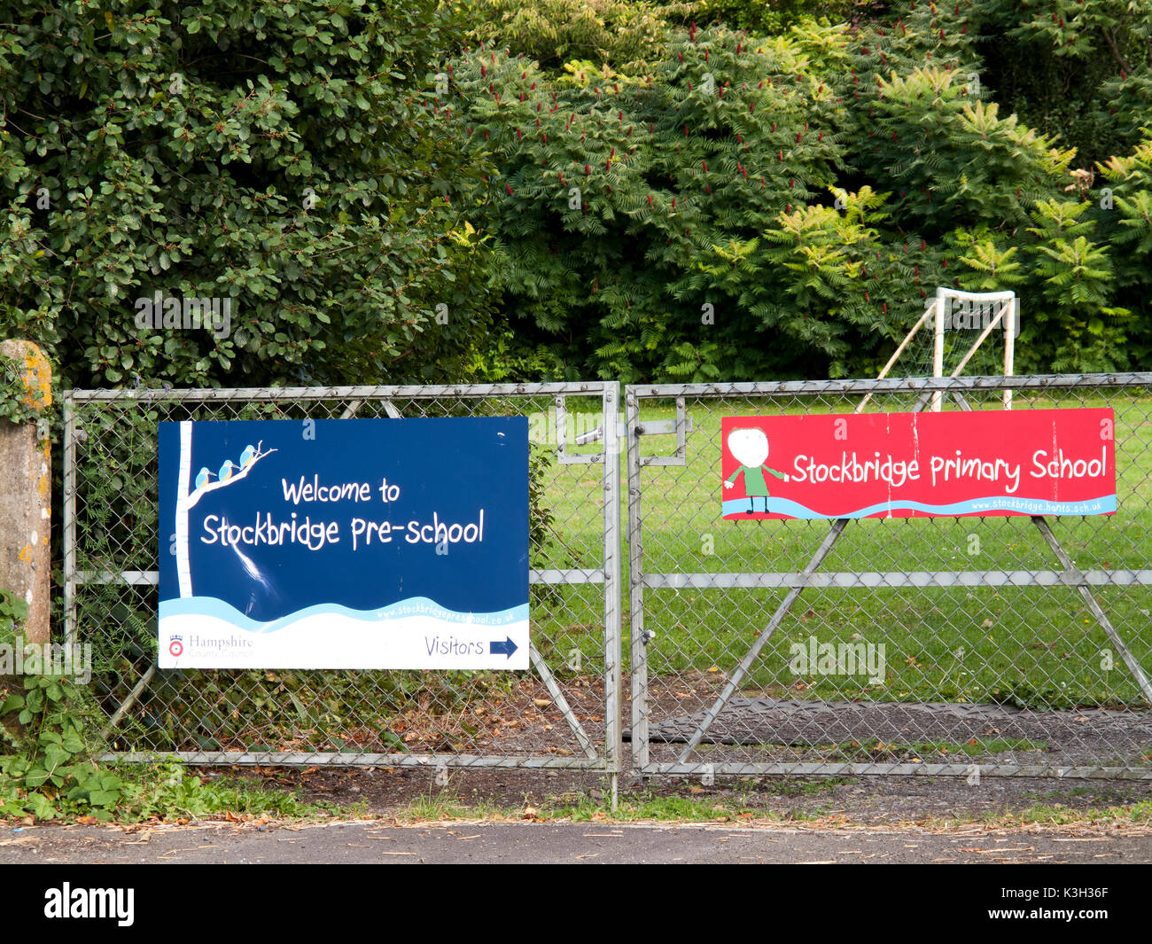 to Stockbridge pre school banner mounted on gate to playing