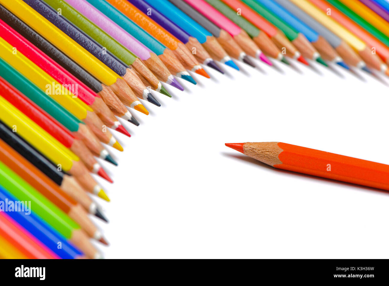 Team and Senior symbolically close coloured pencils displayed Stock Photo