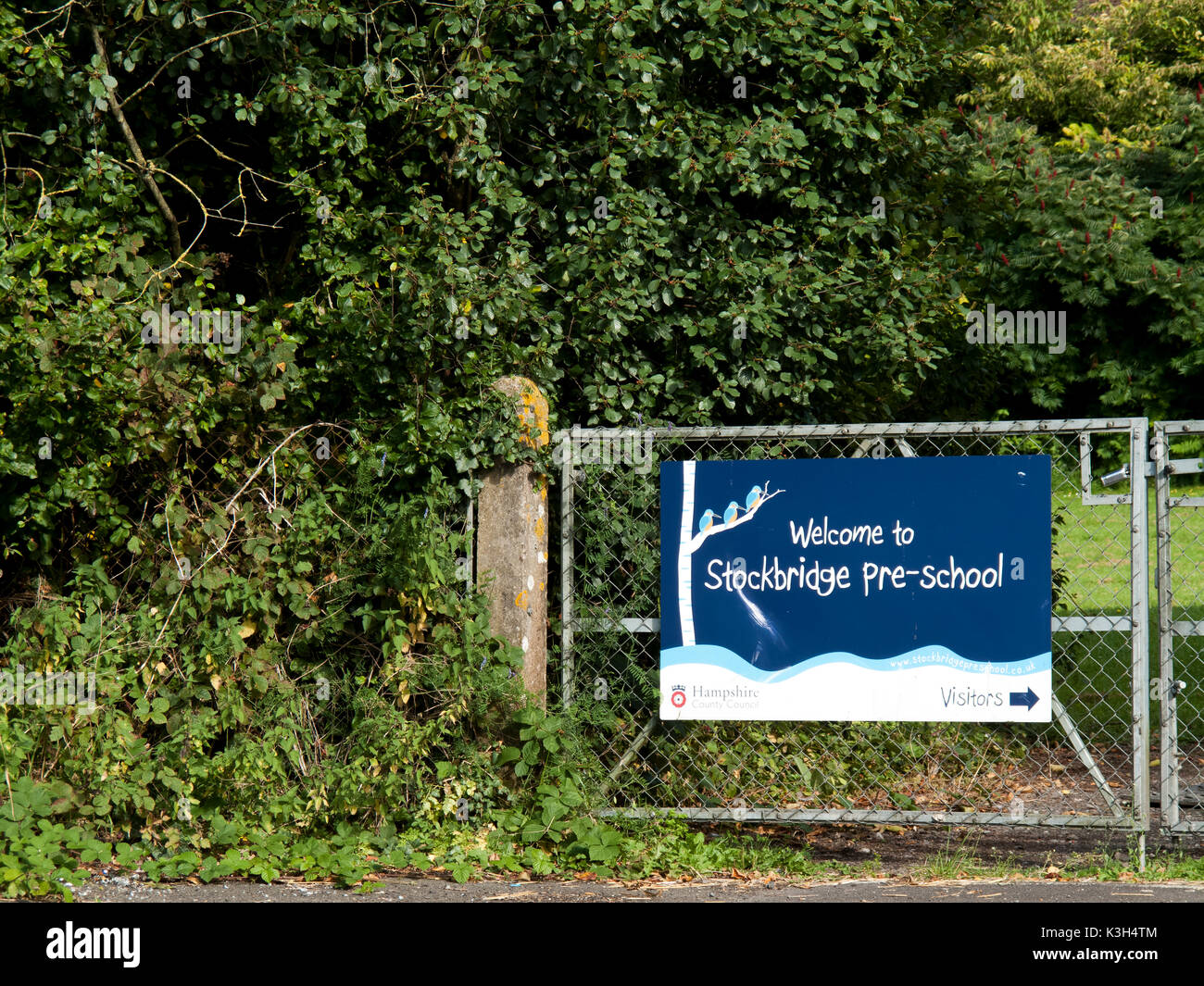 to Stockbridge pre school banner mounted on gate to playing