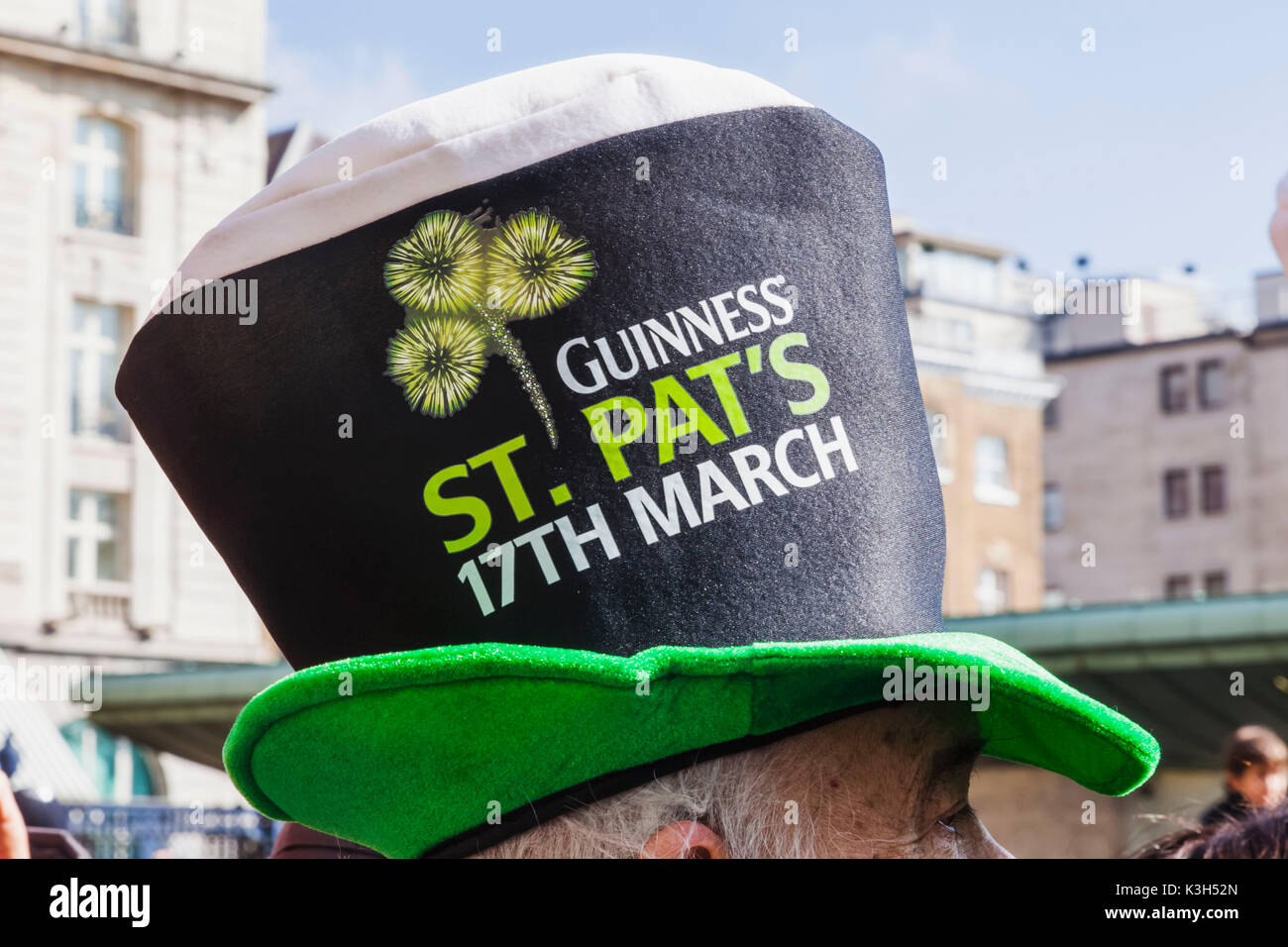 England, London, St.Patrick's Day Parade, Parade Spectator Wearing Guinness Top Hat Stock Photo