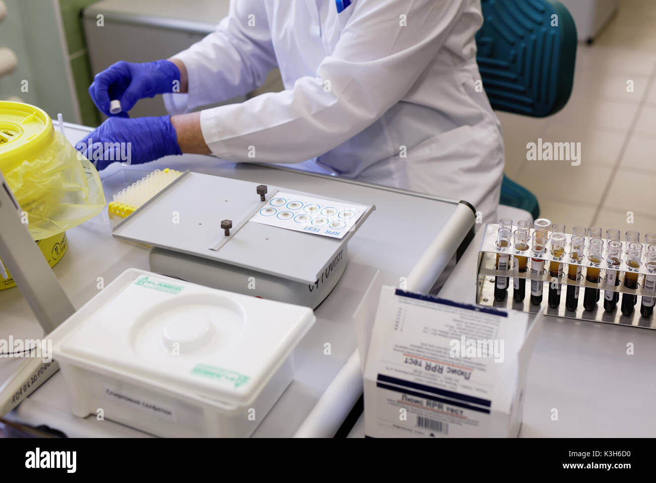 St. Petersburg, Russia - February 20, 2017: Laboratory worker prepares blood plasma samples for RPR test in the city blood transfusion station. This y Stock Photo