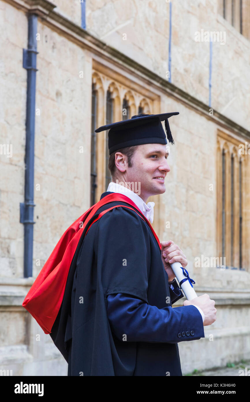 young man wear cap and gown graduation suit Stock Photo | Adobe Stock