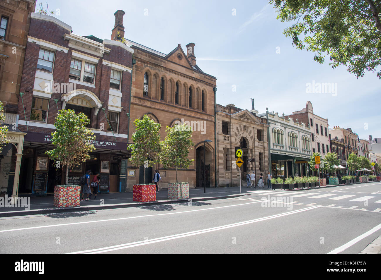 SYDNEY,NSW,AUSTRALIA-NOVEMBER 20,2016: Fortune of War pub brick architecture with street facade and tourists in Sydney, Australia Stock Photo