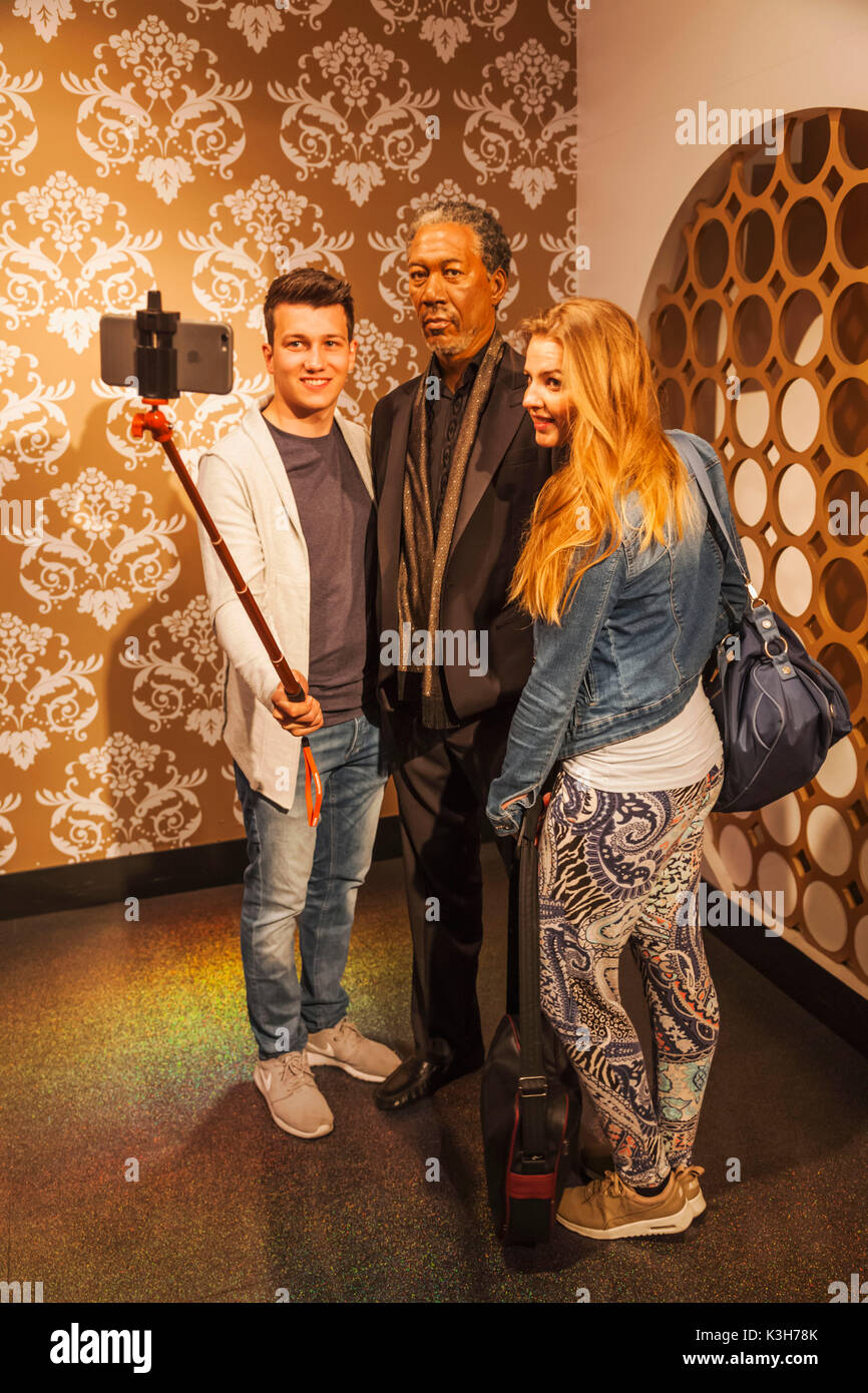 England, London, Madame Tussauds, Tourists Posing with Wax Figure of Morgan Freeman Stock Photo