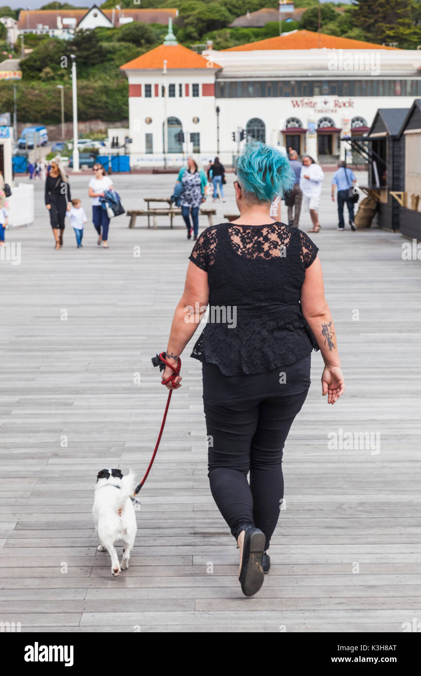 England, East Sussex, Hastings, Hastings Pier, Woman Walking Dog Stock Photo