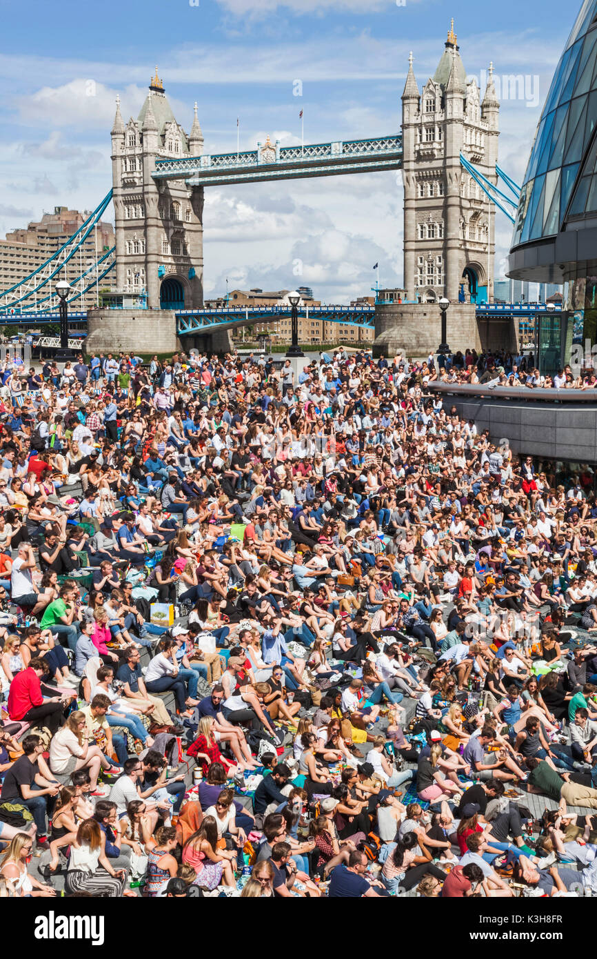 England, London, Southwark, Crowds at the Scoop Open Air Theatre and Tower Bridge Stock Photo