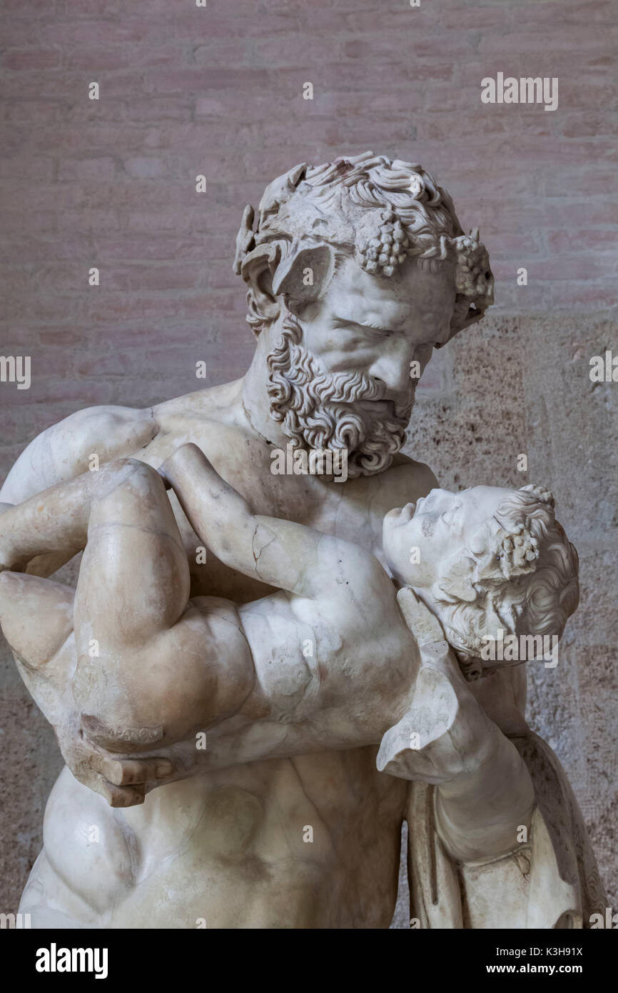Germany, Bavaria, Munich, Glyptothek Museum, Sculpture of Man Holding Baby Stock Photo