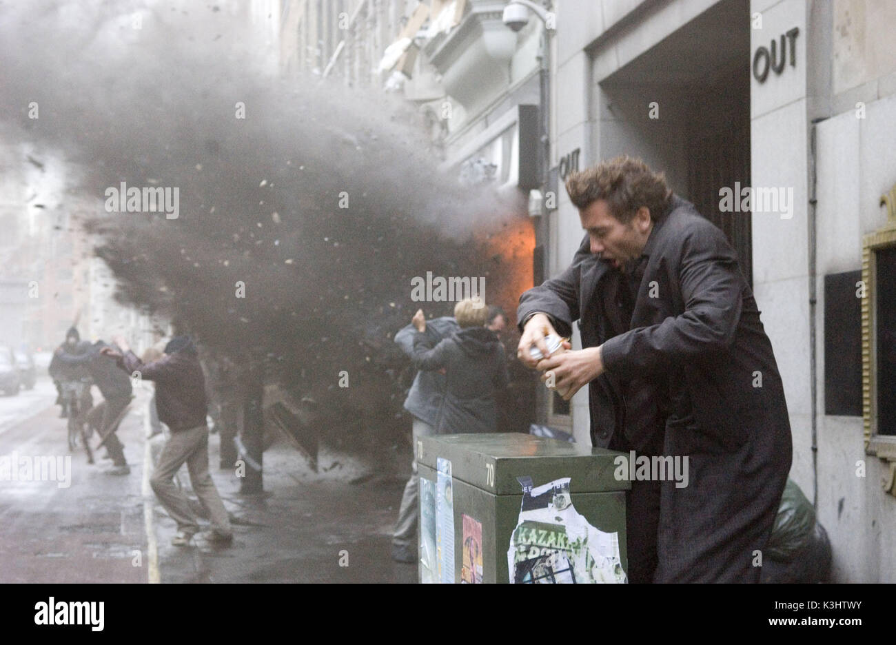 Disillusioned bureaucrat Theo tries to avoid a bomb blast in the thriller Children of Men, directed by acclaimed filmmaker Alfonso Cuaron. Stock Photo