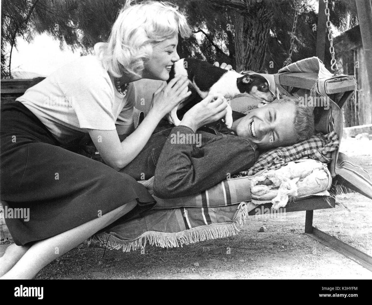 SKY FULL OF MOON JAN STERLING teases co-star CARLETON CARPENTER between scenes with the aid of a lively puppy SKY FULL OF MOON JAN STERLING teases co-star CARLETON CARPENTER between scenes with the aid of a lively puppy Stock Photo