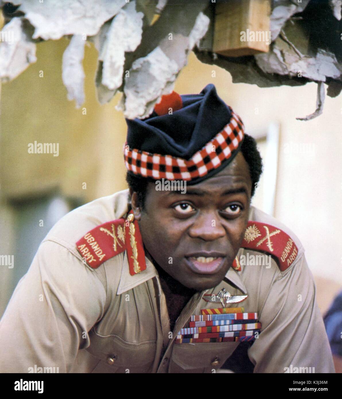 RAID ON ENTEBBE YAPHET KOTTO as President Idi Amin Dada     Date: 1977 Stock Photo