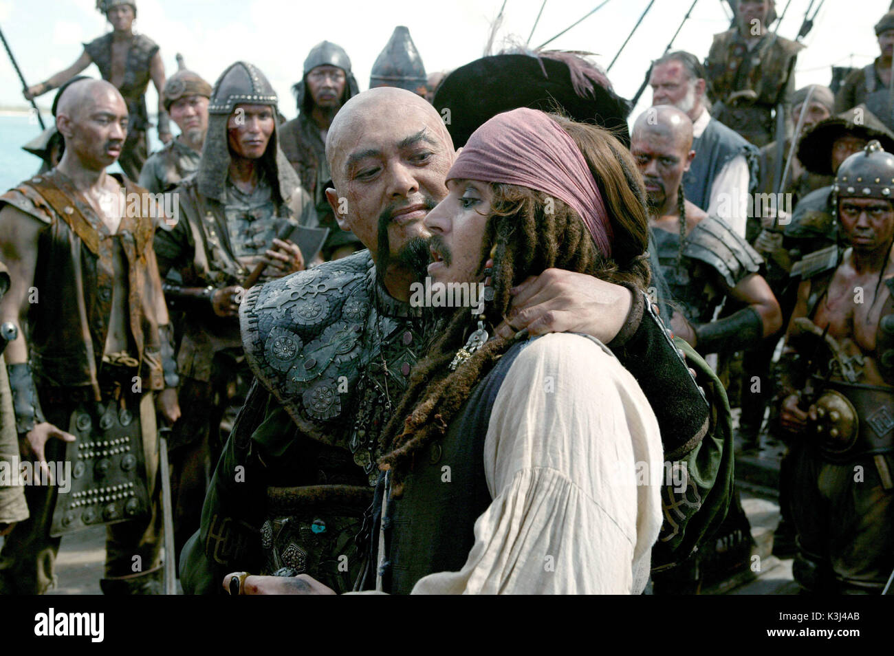 Pictured L-R: Chinese Pirate Sao Feng (Chow Yun-Fat) and Captain Jack Sparrow (Johnny Depp), in a scene from PIRATES OF THE CARIBBEAN: AT WORLD'S END, directed by Gore Verbinski and produced by Jerry Bruckheimer, from a screenplay written by Ted Elliott & Terry Rossio. PIRATES OF THE CARIBBEAN: AT WORLD'S END [US 2007]  aka PIRATES OF THE CARIBBEAN 3  CHOW YUN-FAT as Chinese Pirate Sao Feng   JOHNNY DEPP as Captain Jack Sparrow    Pictured L-R: Chinese Pirate Sao Feng (Chow Yun-Fat) and Captain Jack Sparrow (Johnny Depp), in a scene from PIRATES OF THE CARIBBEAN: AT WORLD'S END, directed b Stock Photo