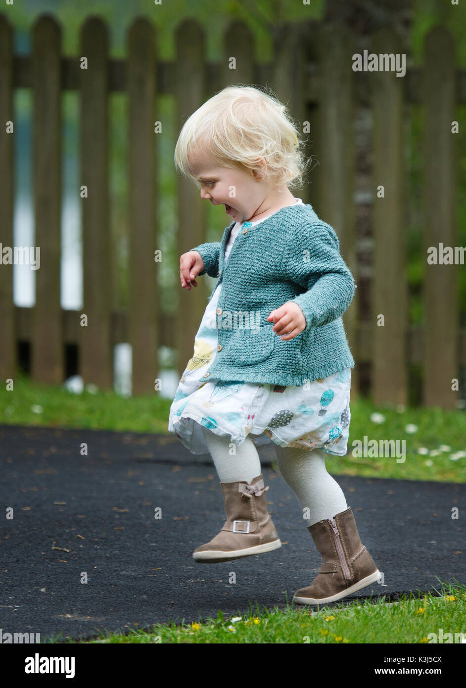 A toddler playing in a park Stock Photo