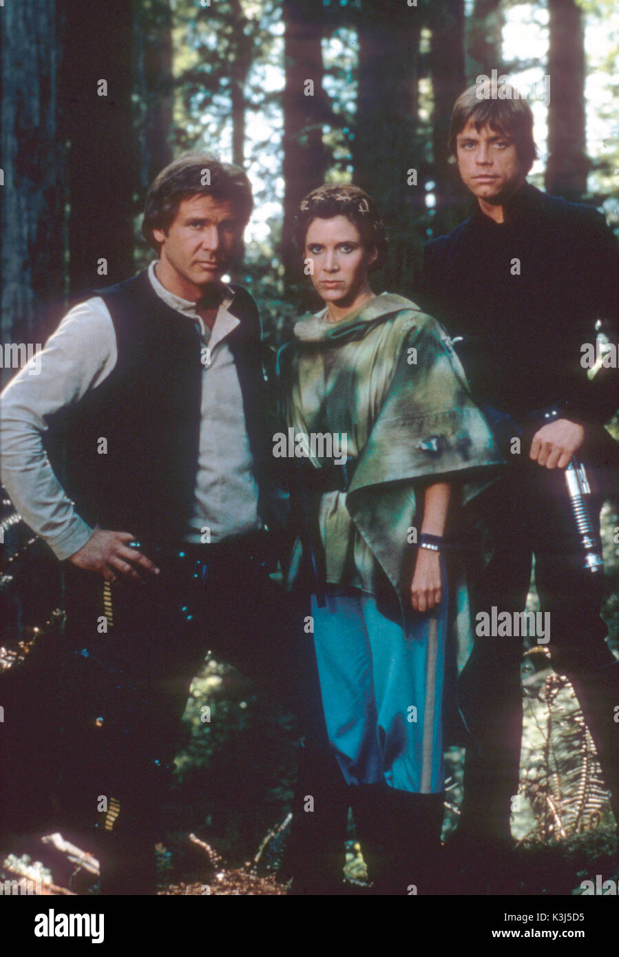 STAR WARS: EPISODE VI - RETURN OF THE JEDI HARRISON FORD as Han Solo, CARRIE FISHER as Princess Leia, MARK HAMILL as Luke Skywalker     Date: 1983 Stock Photo