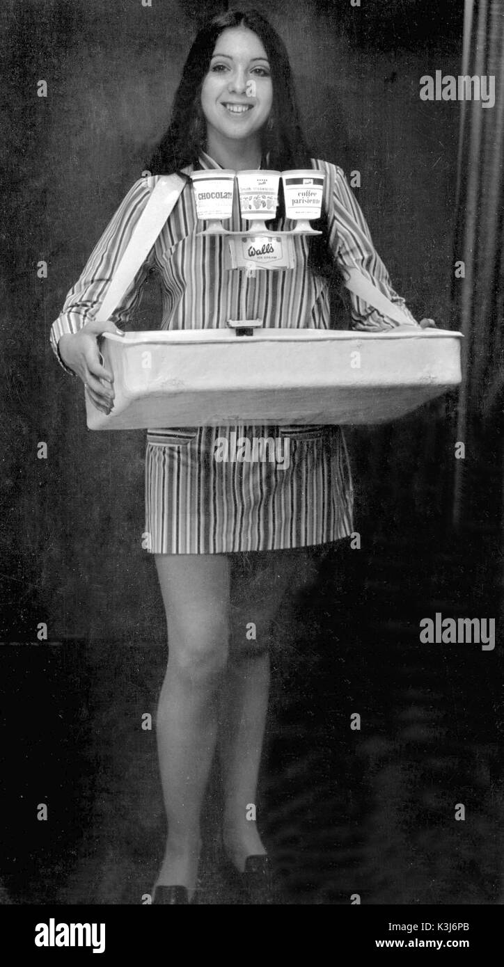 ICE CREAM GIRL 1960s An usherette / memeber of the cinema staff acting as an ice cream girl Stock Photo