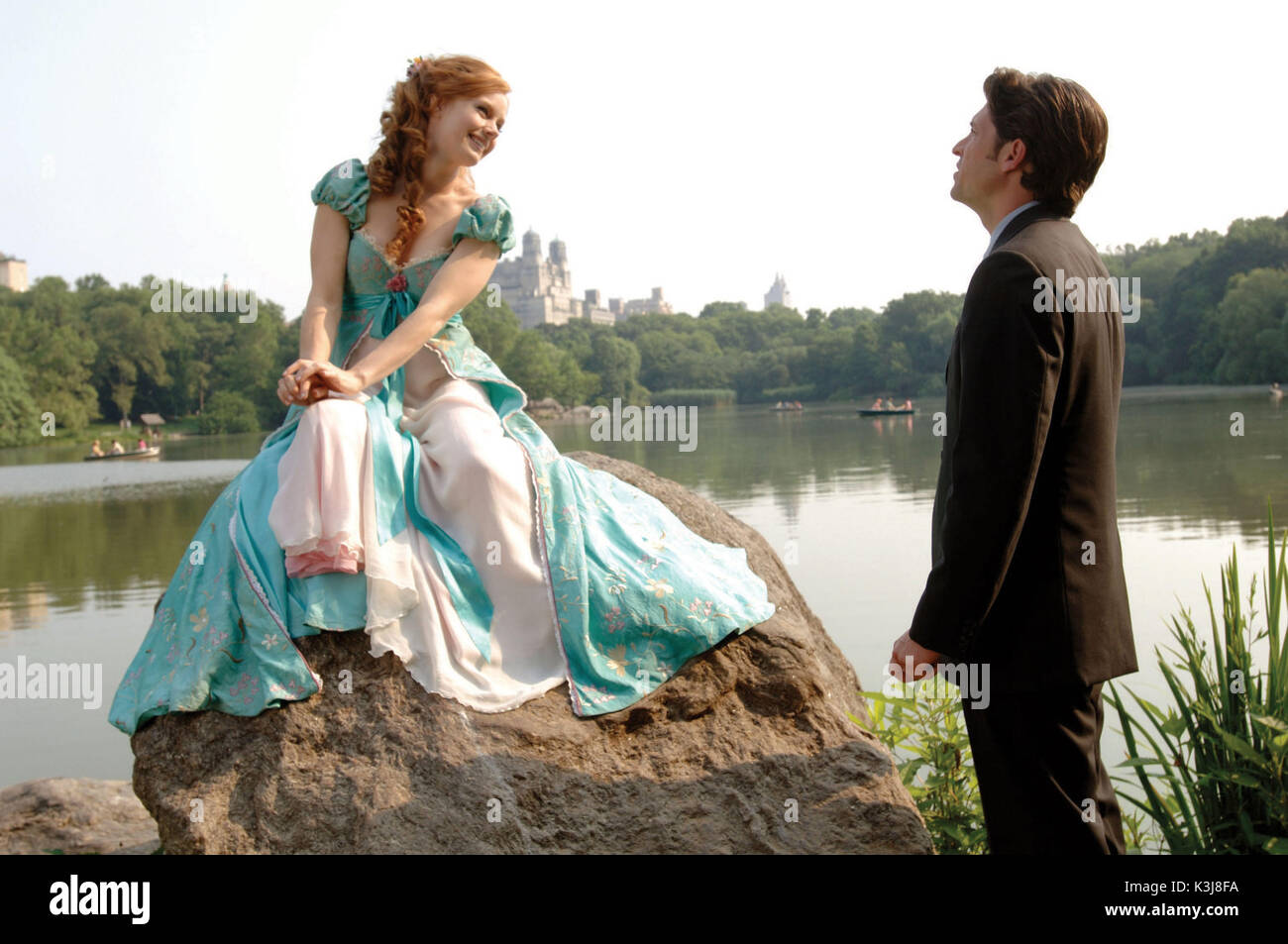 A classic Disney fairytale collides with modern-day New York City in a story about a fairytale princess, Giselle (AMY ADAMS), from the past who is thrust into present-day by the evil Queen Narissa/Hag (SUSAN SARANDON). Soon after her arrival, Princess Giselle begins to change her views on life and love after meeting a handsome lawyer (PATRICK DEMPSEY). Can a storybook view of romance survive in the real world? The chipmunk Pip is Giselle's trusted friend. JAMES MARSDEN is Prince Edward and IDINA MENZEL is Nancy. ENCHANTED is directed by Kevin Lima. ENCHANTED [US 2007]  AMY ADAMS, PATRICK DEMPS Stock Photo