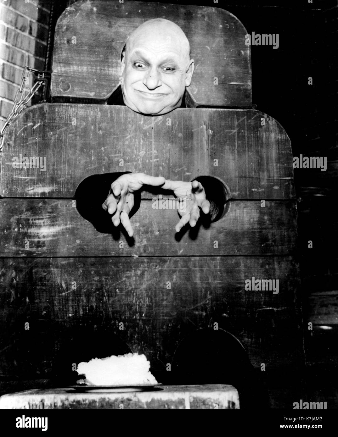 Uncle fester addams family Black and White Stock Photos & Images - Alamy
