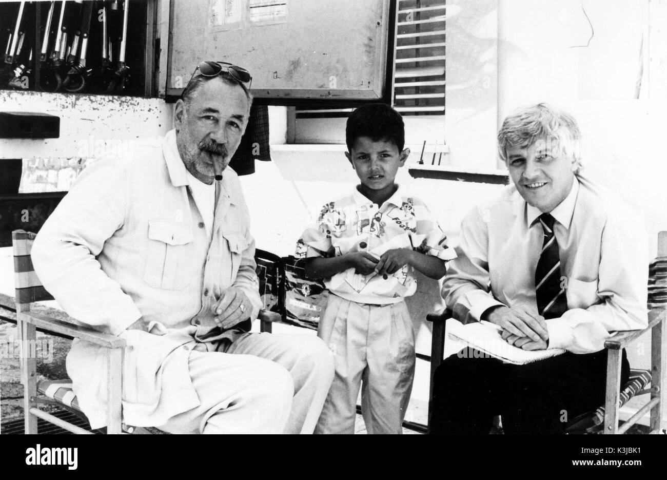 NUOVO CINEMA PARADISO aka CINEMA PARADISO From left - PHILIPPE NOIRET who plays the projectionist, SALVATORE CASCIO who is the main character Salvatore as a achild, JACQUES PERRIN is Salvatore as an adult Stock Photo