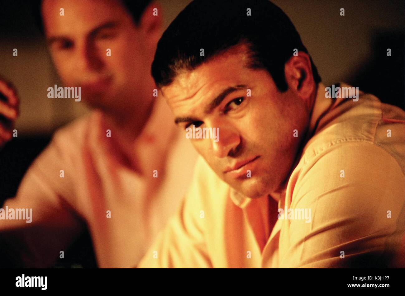 THE BUSINESS Tamer Hassan as Charlie with Danny Dyer as Frankie in the background.     Date: 2005 Stock Photo