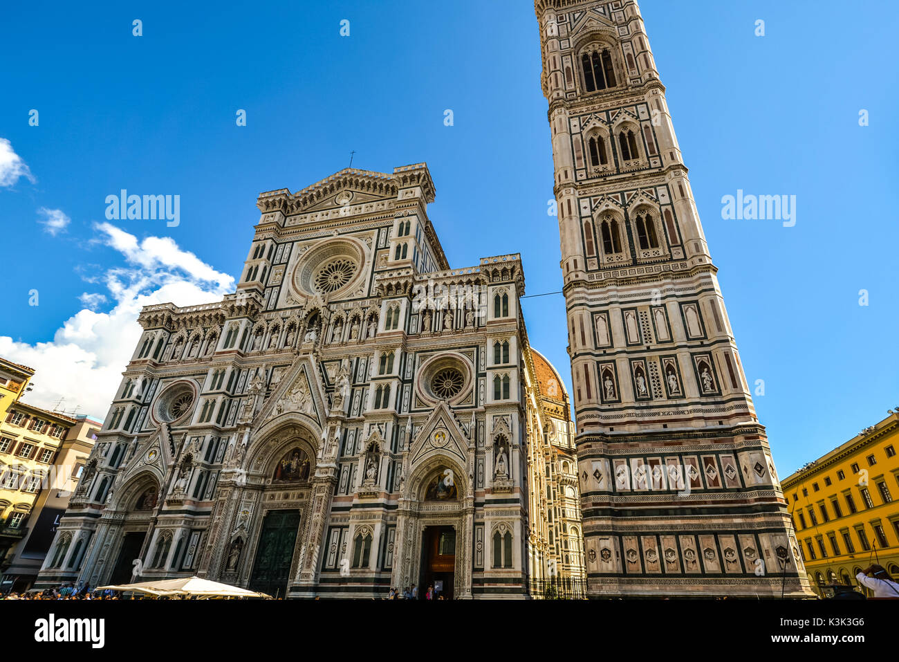 The Florence Cathedral or Santa Maria del Fiore alongside Giotto's Campanile or Bell Tower on the Piazza del Duomo in Florence Italy Stock Photo