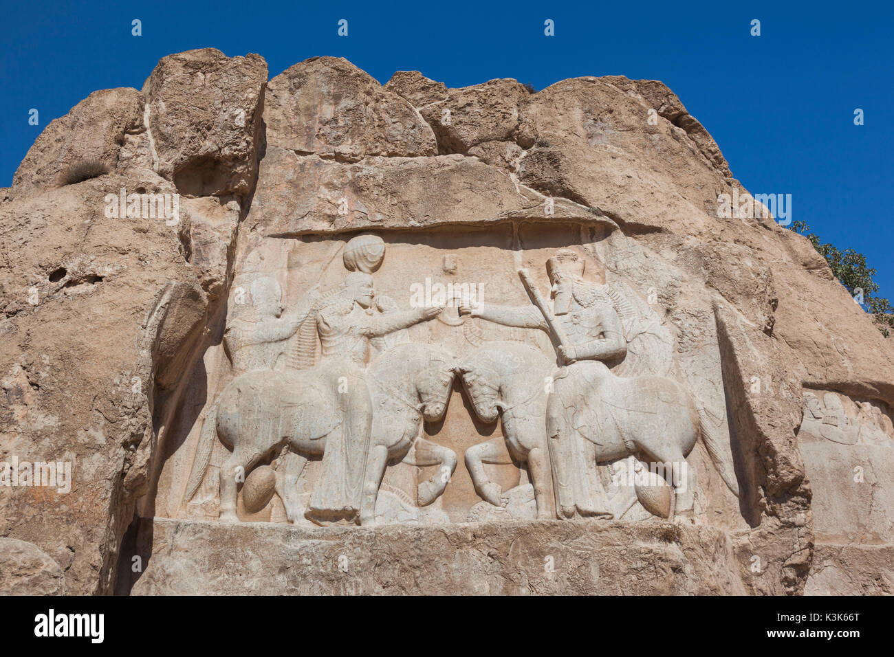 Iran, Central Iran, Shiraz, Naqsh-e Rostam, Sassanian stone reliefs cut into mountain Stock Photo