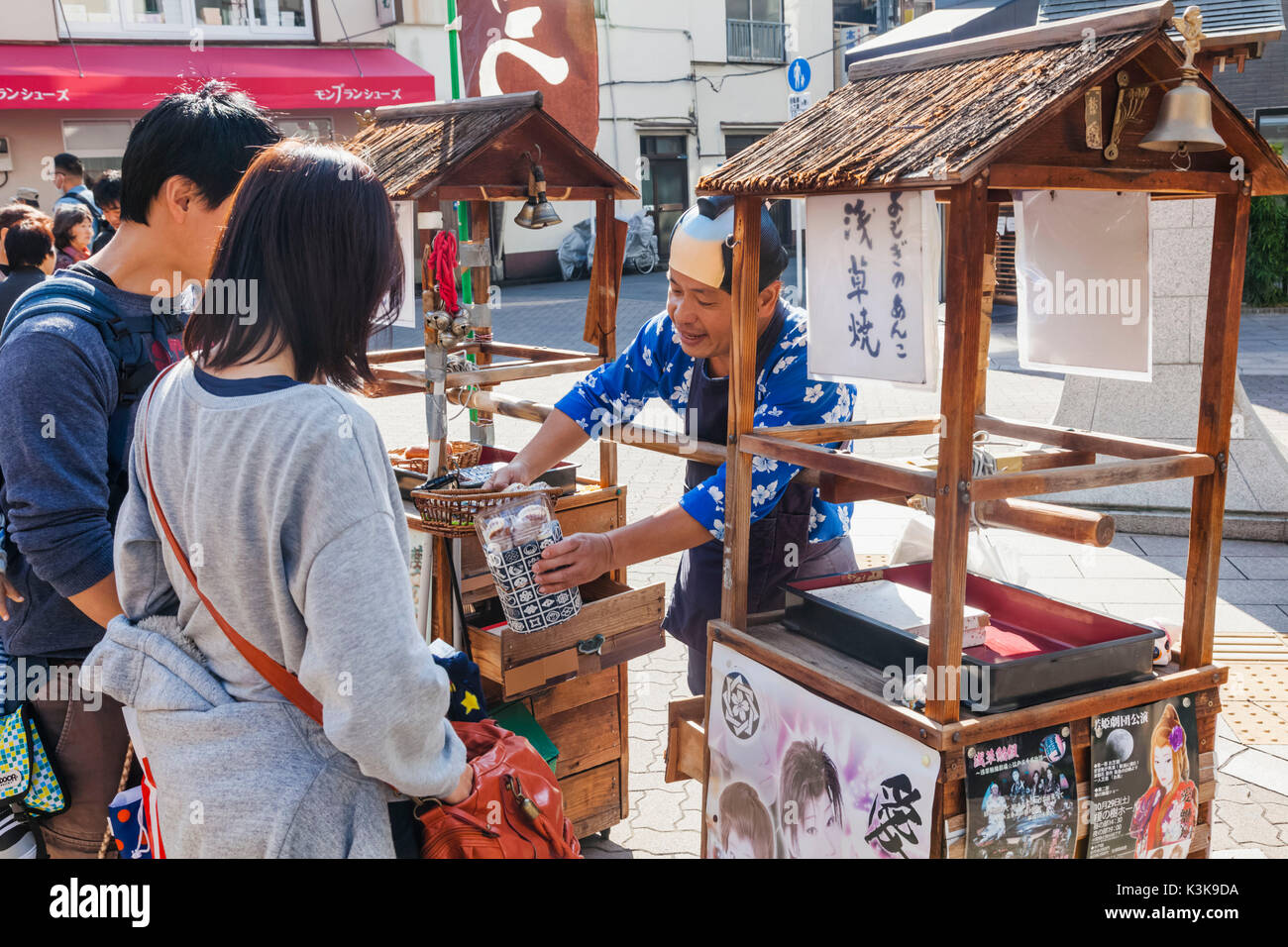 Japan, Hoshu, Tokyo, Asakusa, Street Scene with Traditional Cookie Vendor Stock Photo