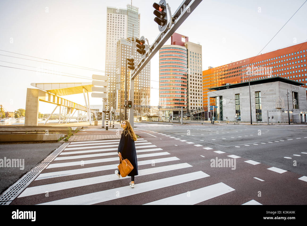 Woman walking the street in Rotterdam Stock Photo - Alamy