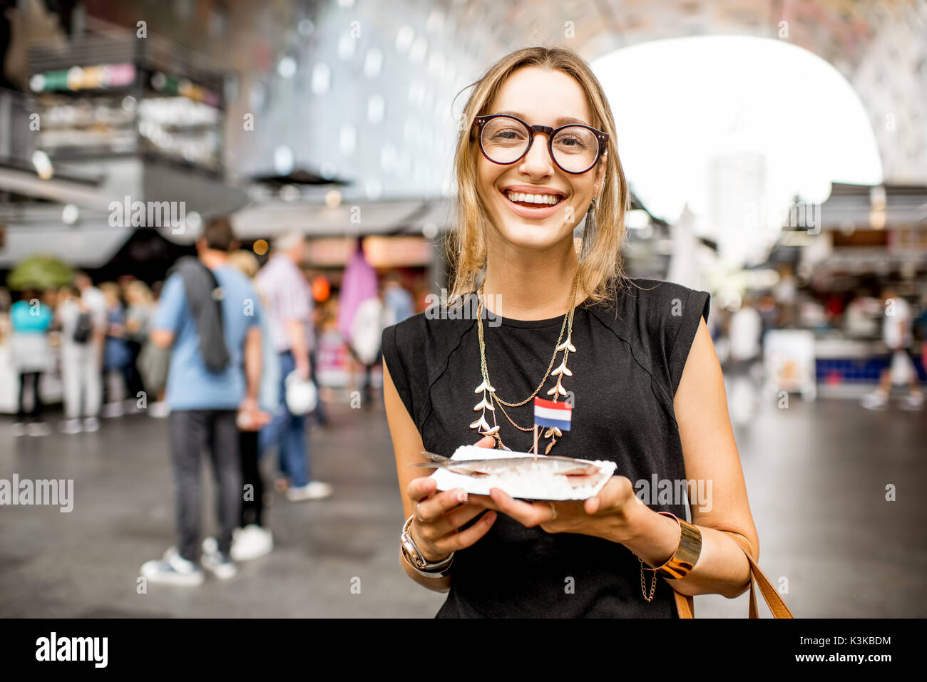 Woman eating new herring hires stock photography and images Alamy