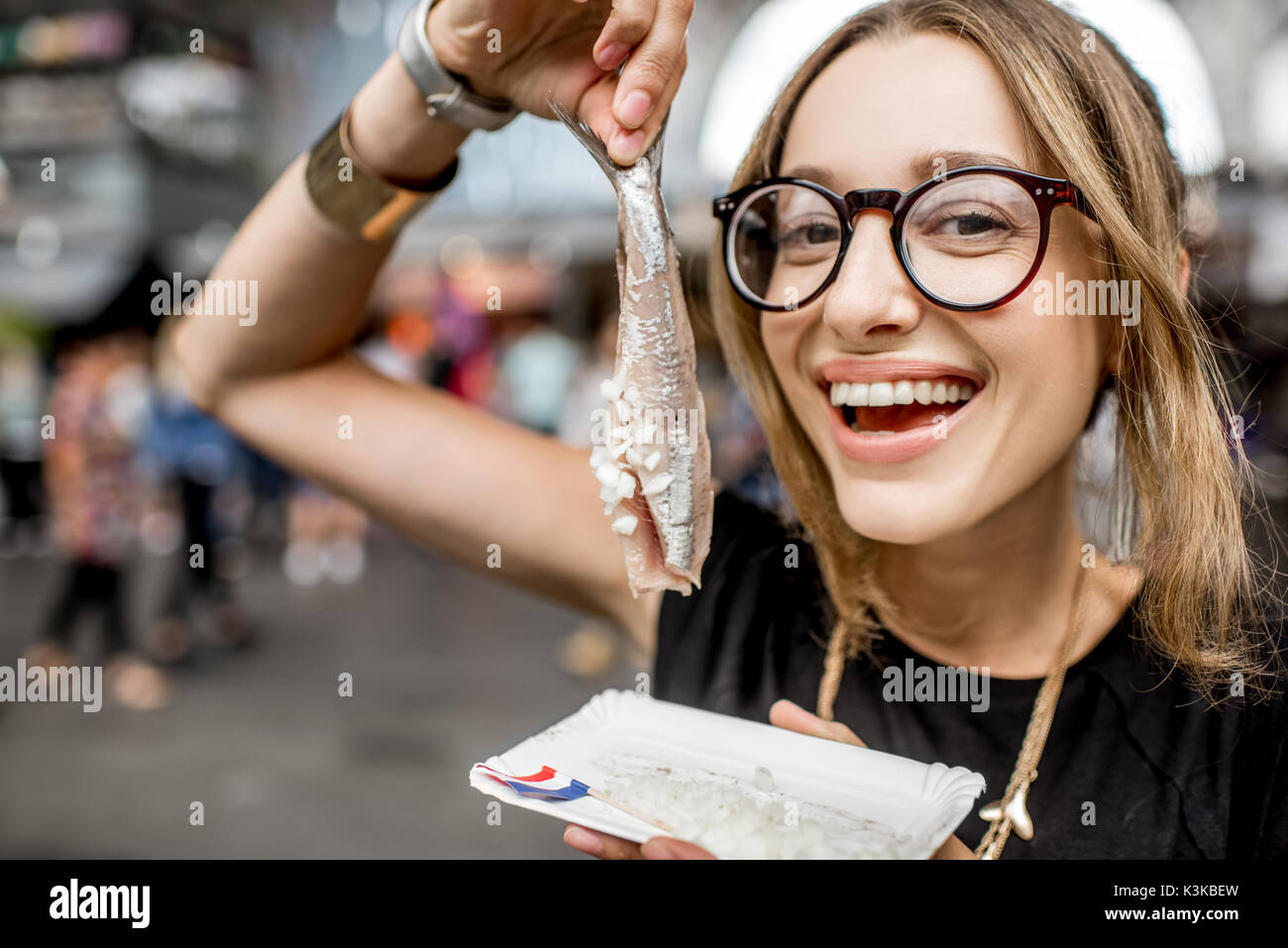 Woman with dutch herring Stock Photo Alamy