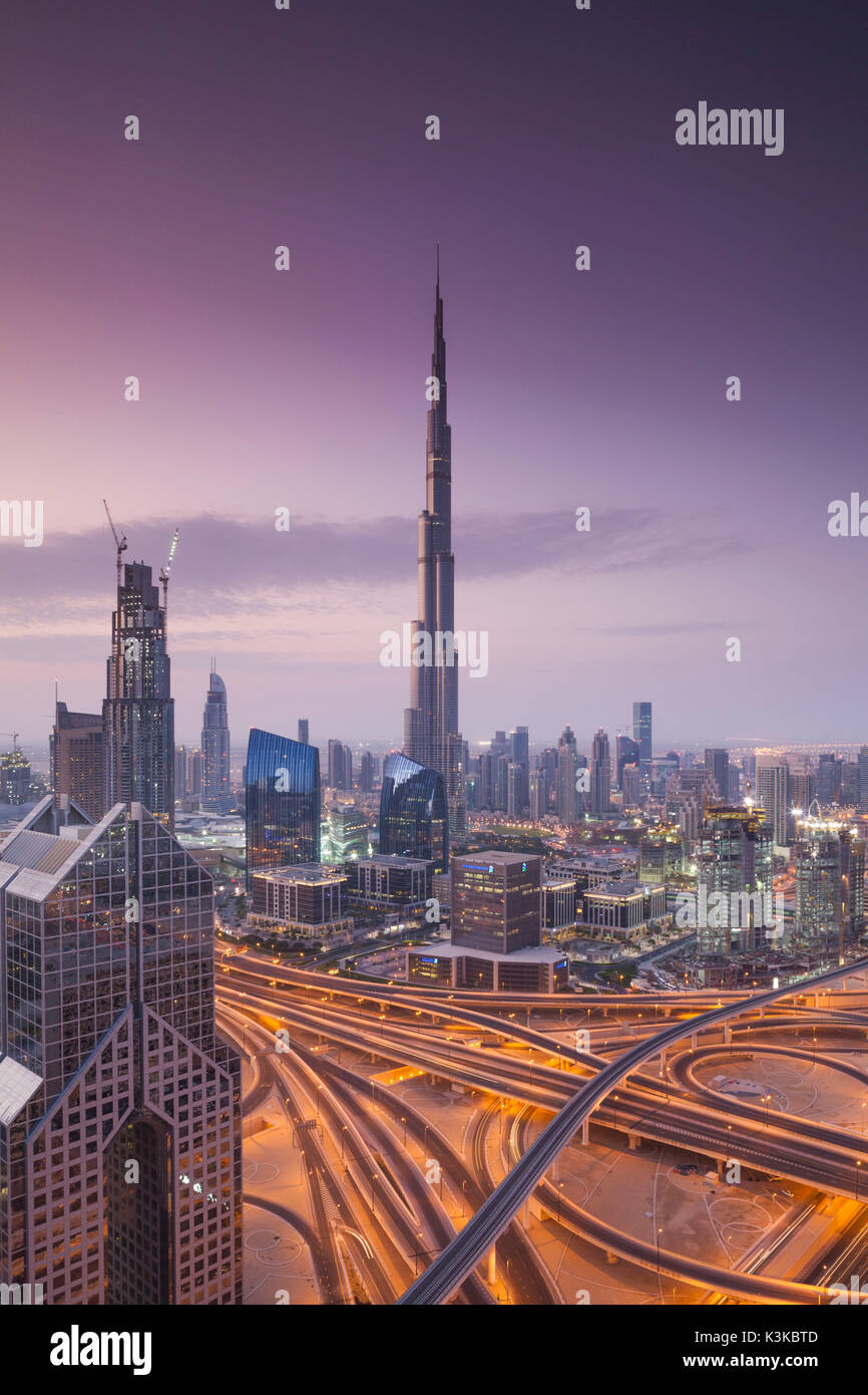 UAE, Dubai, Downtown Dubai, eleavted view over Sheikh Zayed Road and Burj Khalifa Tower, world's tallest building, 2016, dawn Stock Photo
