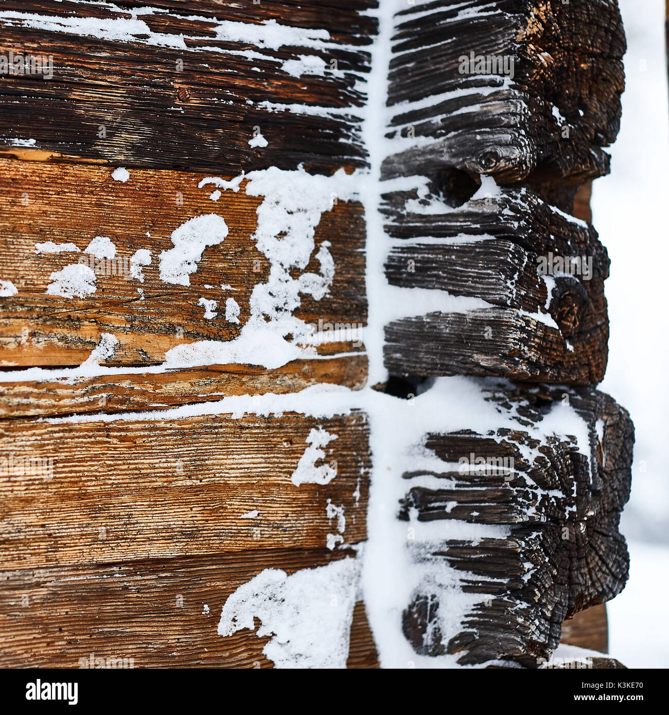 old wooden beams of hut, snowdrift, medium close-up, detail Stock Photo