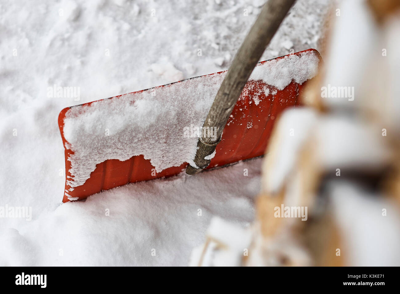 Snow shovel, snow, wood pile, detail, medium close-up, blur Stock Photo